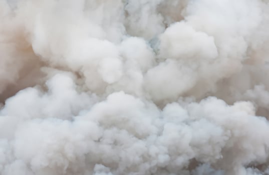 Cinematic Close-Up of Swirling White Smoke and Billowing Black Smoke from Ignition Source photo