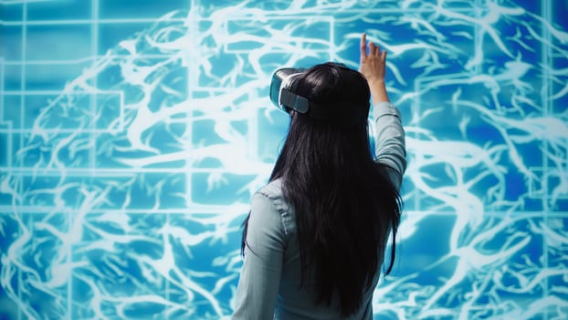 Developer wearing VR headset looking at hologram of artificial intelligence human brain simulation. Programmer interacting with AI visualization showing machine learning algorithms, camera B photo