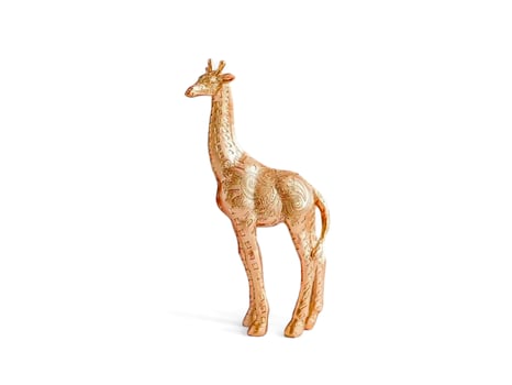 Gold giraffe miniature isolated on white photo