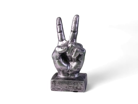 silver hand decoration with piece shapes on a white background photo