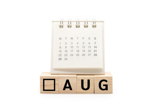 Calendar on Wooden blocks with AUG text isolated on white background. August and Calendar concept. Copy space. photo