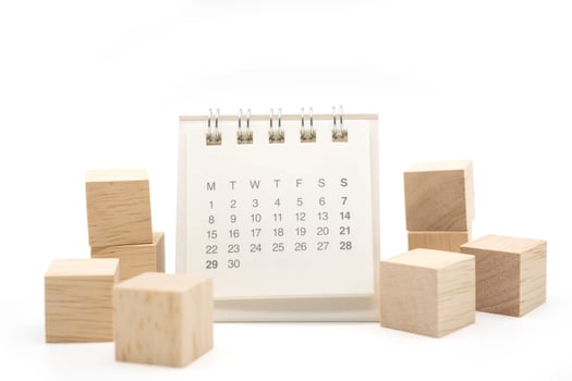 Blank wooden blocks and Calendar on white background with copy space for input wording and infographic icon. Wooden blocks with Calendar. photo
