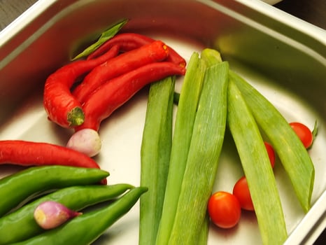 a set of kitchen spices. Red chilies, garlic, onions and leeks. Cooking preparation ingredient on the kitchen photo