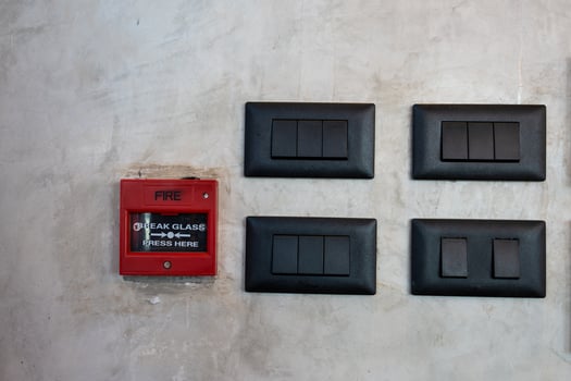 Black light switches and fire alarm clock. photo