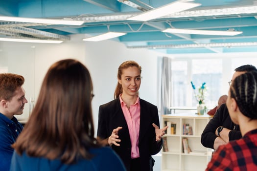 A diverse team of young business people exchanging ideas in a modern startup office photo