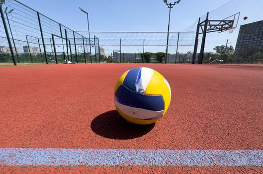 volleyball ball with blurred arena in background. photo