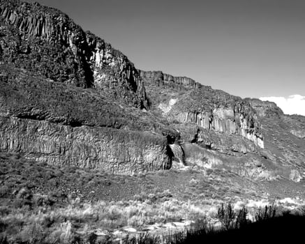 Mountains black and white photo background. High mount, rocks and hills landscape