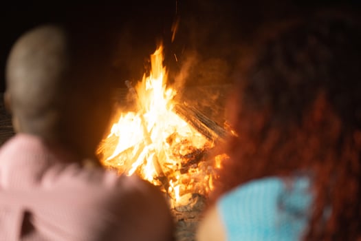 Couple friends front a bonfire. photo