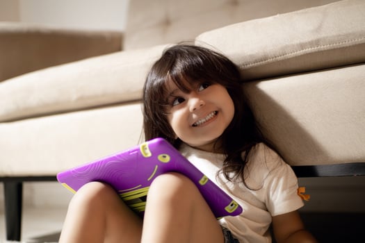 Happy baby girl using a digital tablet. photo