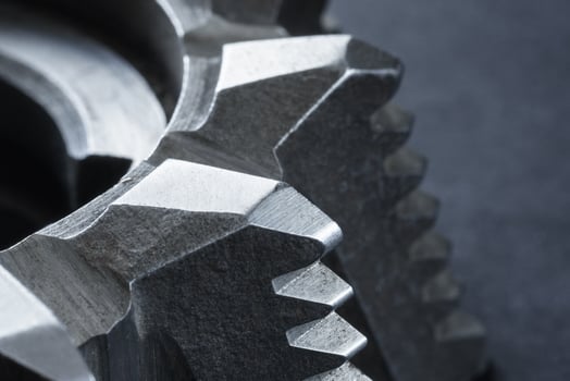 Close up view of a fragment of steel milling cutter on a dark background photo