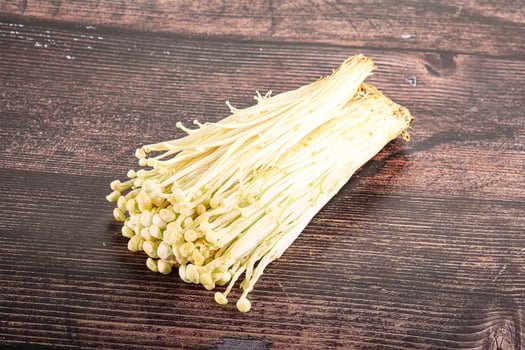 Tasty raw enoki mushroom heap photo