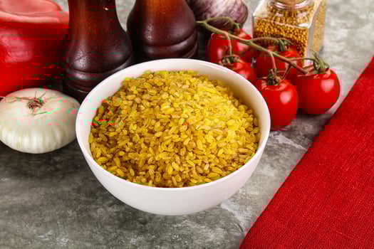 Dry wheat bulgur cereal heap photo
