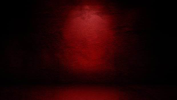 Minimalist Studio with Red-Lit Concrete Wall, Ideal for Product Displays photo