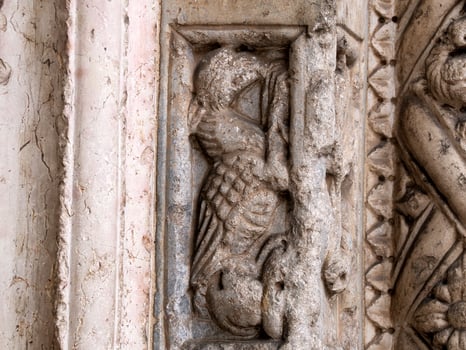 Verona dome cathedral church exterior sculptures detail. Romanesque sculpture attributed to the workshop of Veronese sculptor Brioloto photo