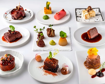 a collection of different types of food on white plates photo
