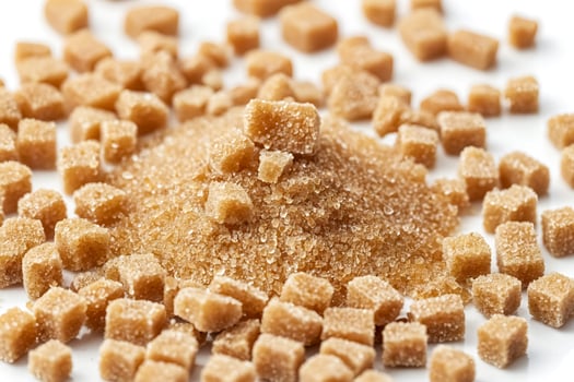 Brown Sugar Cubes on White Background photo