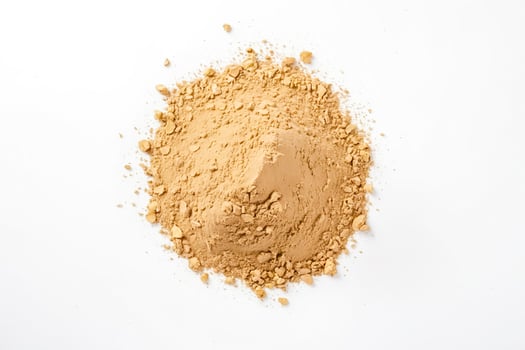 Brown Powder Pile on White Background photo
