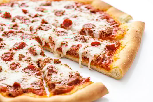 Close-up of a slice of pepperoni pizza with melted cheese photo
