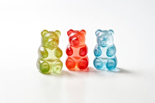 Three Colorful Gummy Bear Candy on White Background photo