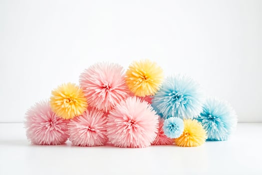 Colorful Paper Pom-Poms on White Background photo