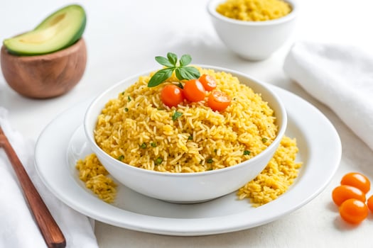 Close Up of Yellow Rice with Cherry Tomatoes and Basil photo