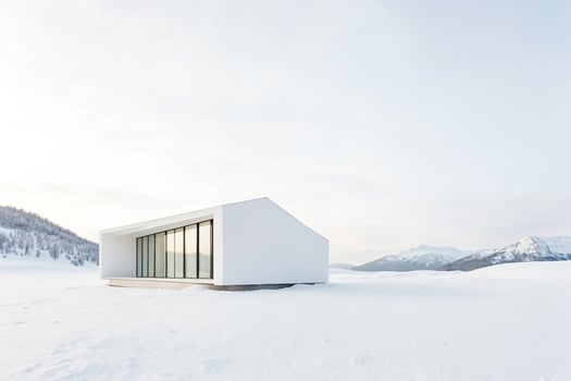 Minimalist White House in Snowy Landscape photo