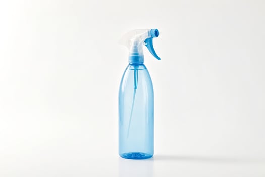 Blue Spray Bottle on White Background photo
