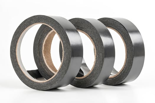 Black Duct Tape Rolls On White Background photo