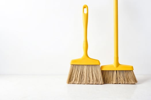 Yellow Broom on White Background photo