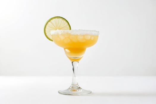 Margarita Cocktail with Salt Rim and Lime Garnish photo