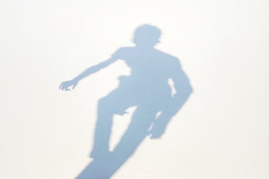 Shadow of a Person on a White Surface photo