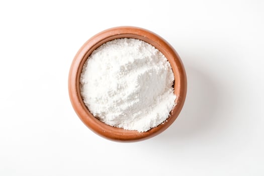 Top View of White Powder in a Brown Bowl photo