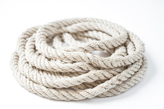 Close-up of a white rope coil on a white background photo