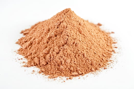 Cocoa powder pile on white background photo