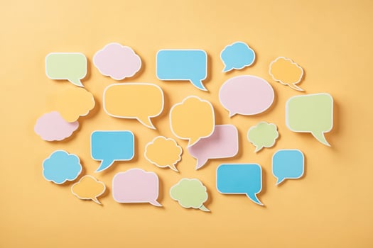 Colorful Speech Bubbles on Yellow Background photo