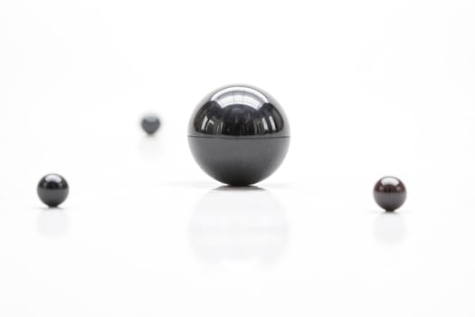 Spheres of Different Sizes on White Backgroun photo