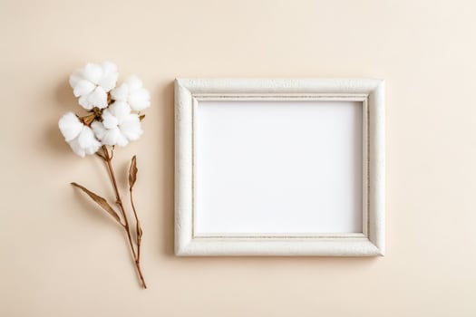 Minimalist Mockup with Cotton Flower and White Frame photo