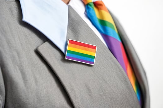 Close Up of a Rainbow Pride Pin on a Suit Jacket photo