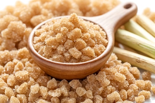 Close up of brown sugar in a wooden spoon photo