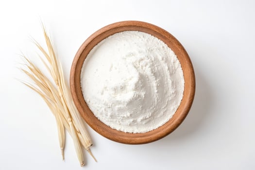 Flour in a wooden bowl with dried grass photo