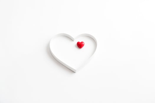 White Heart Outline with Red Heart Inside photo