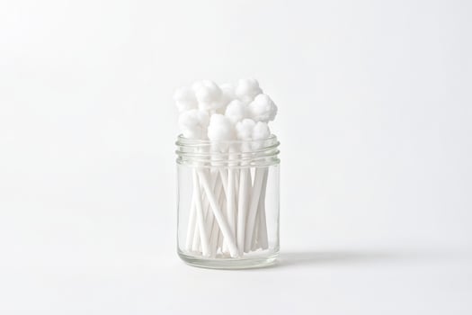 Cotton swabs in a glass jar photo