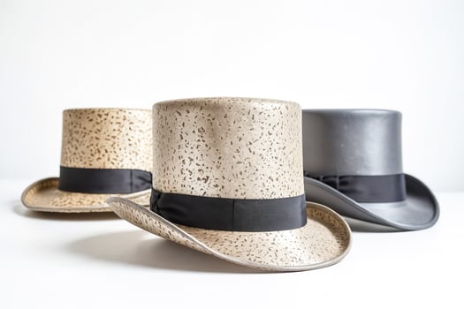 Three Elegant Top Hats on a White Background photo