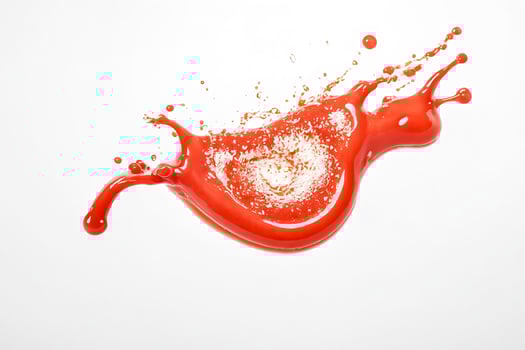 Red liquid splash isolated on white background photo
