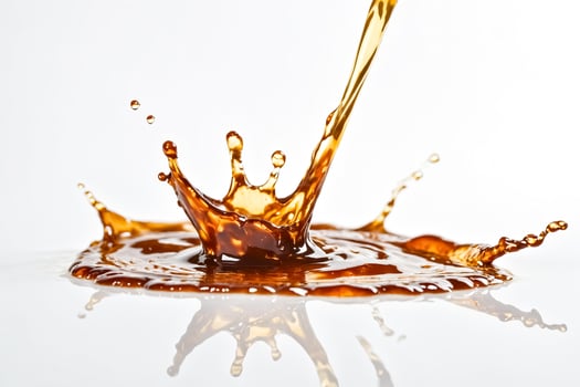 Close Up Splash of Brown Liquid photo
