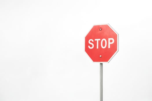 Red Stop Sign Against White Background photo