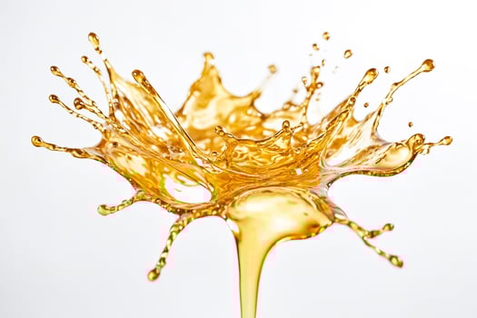 Golden Liquid Splashing on White Background photo