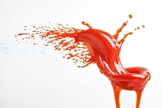 Red Liquid Splashing and Dripping on White Background photo