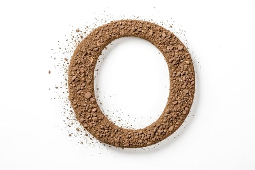 Letter O made of dirt photo