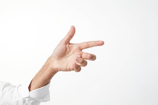 Close-up of a man's hand pointing to the right, isolated on a white background photo